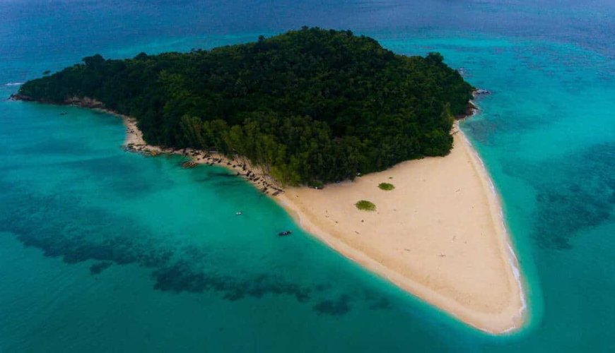 The featured image for our Bamboo Island tour at Sunrise with the island seen from drone above.