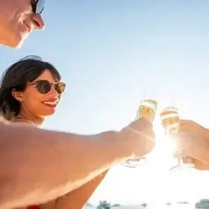 People toasting with glasses of champagne.