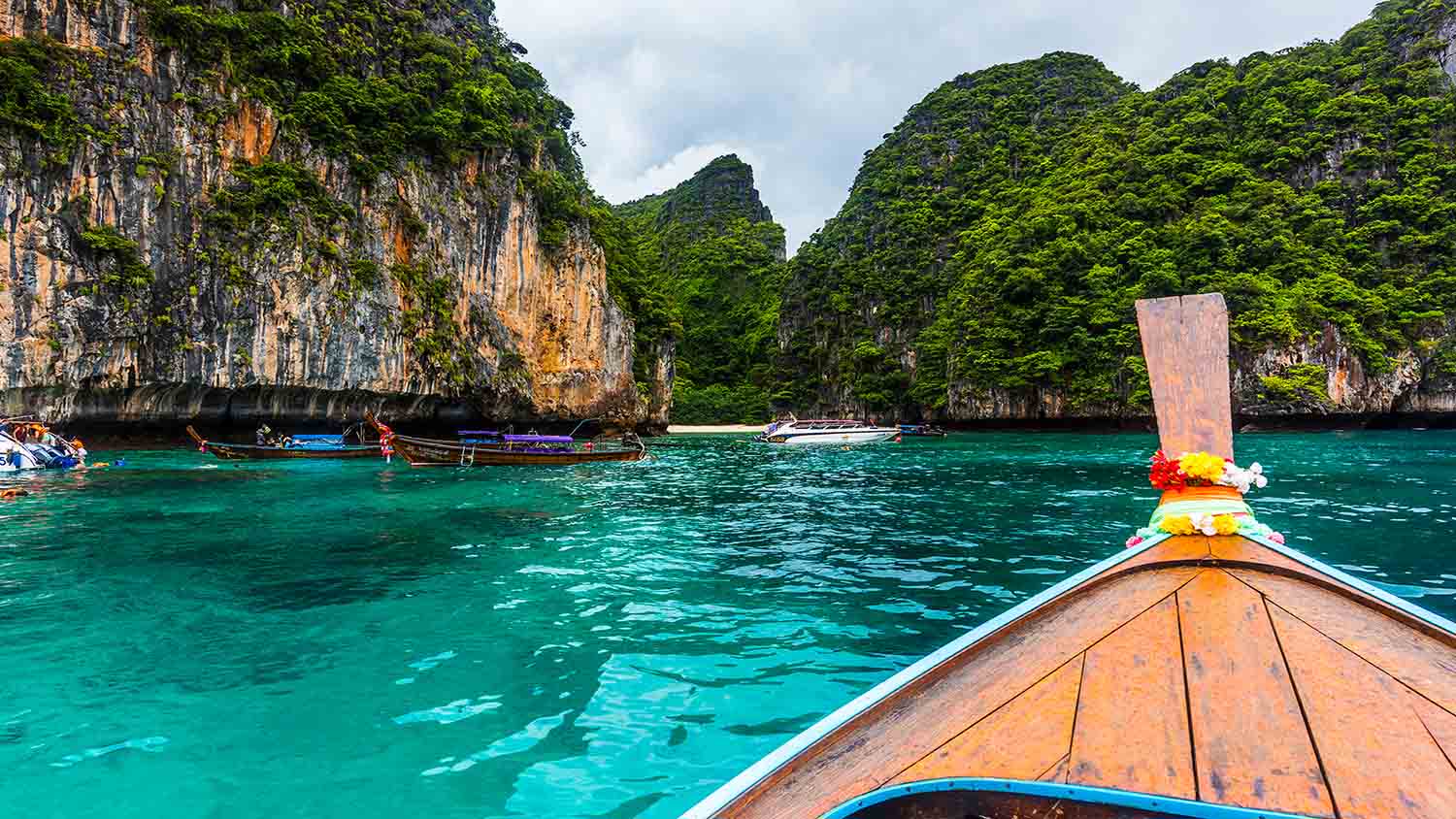 Scenic island landscape with boats and clear blue water
