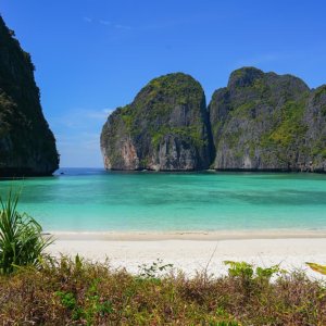 Stunning Maya Bay in Thailand with crystal clear waters and lush green cliffs