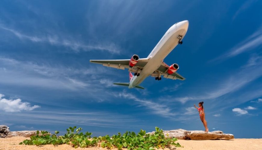 a plane arrives at phuket island