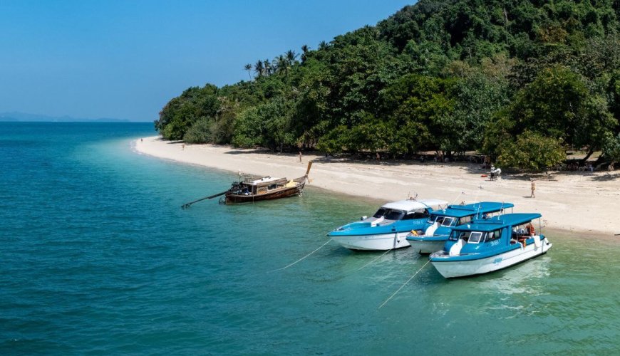 Phi Phi Private Boat Tour with boats anchored at Bamboo Island